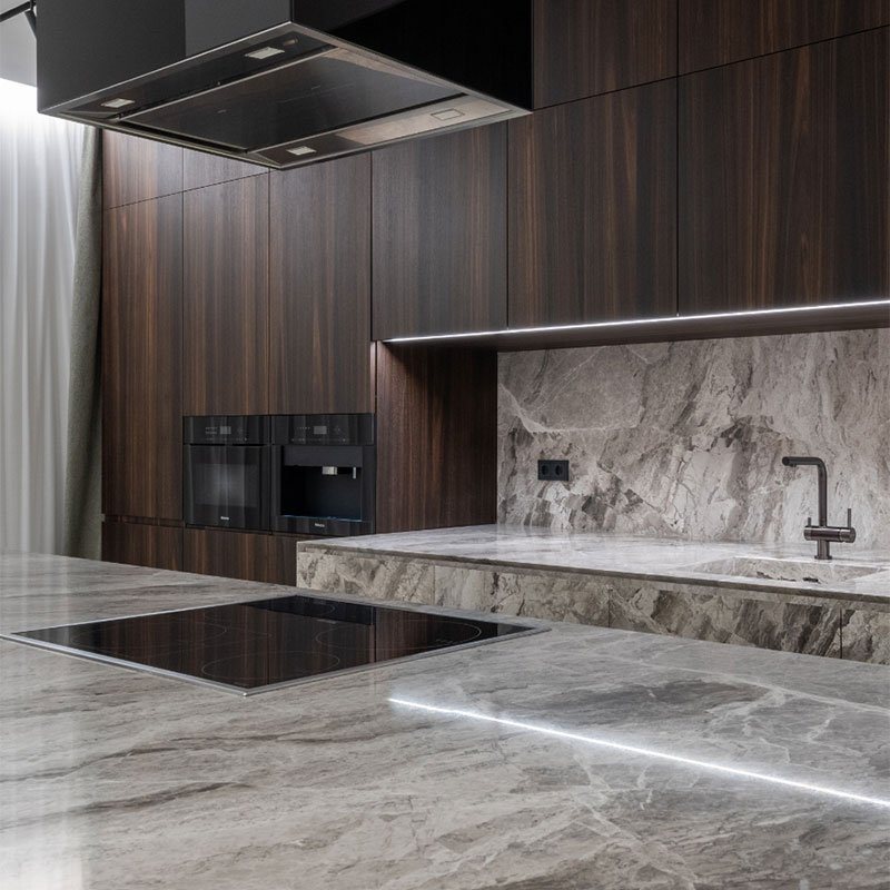 Modern kitchen with marble worktops and a central island
