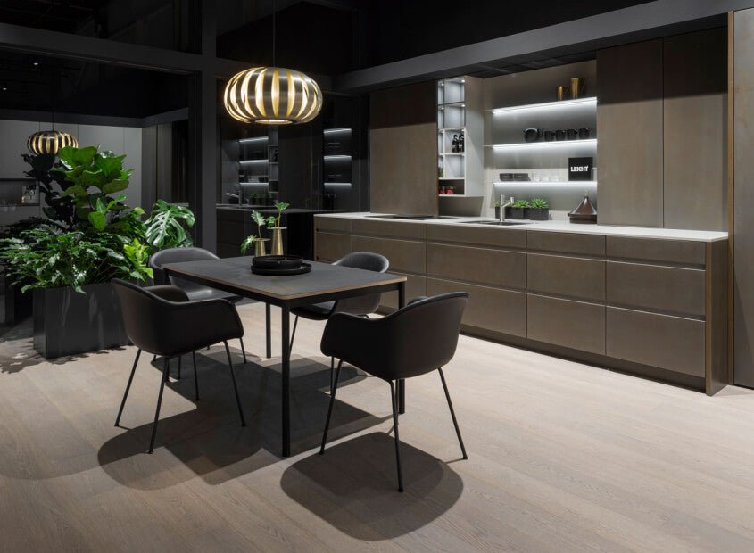 Contemporary dining area with dark cabinetry and pendant lighting