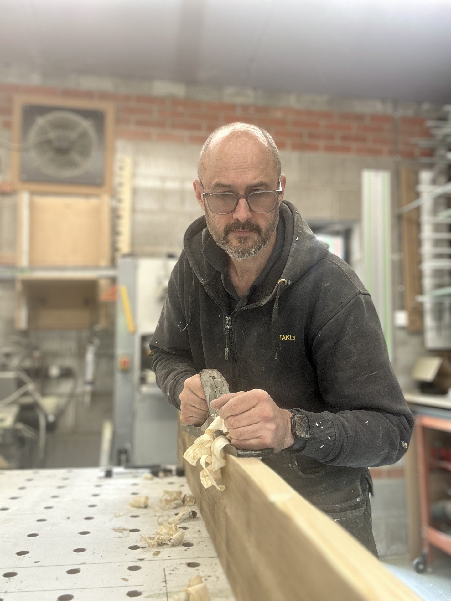 James Doughty planing a length of timber at the workbench James Doughty planing a length of timber at the workbench