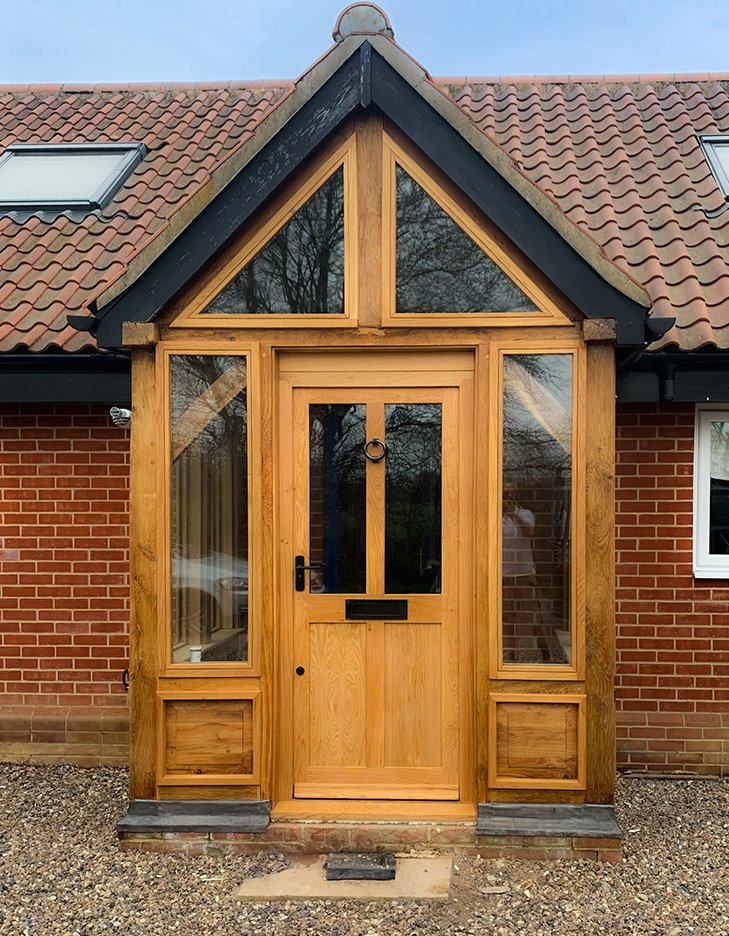 Completed oak-framed porch with a tiled roof