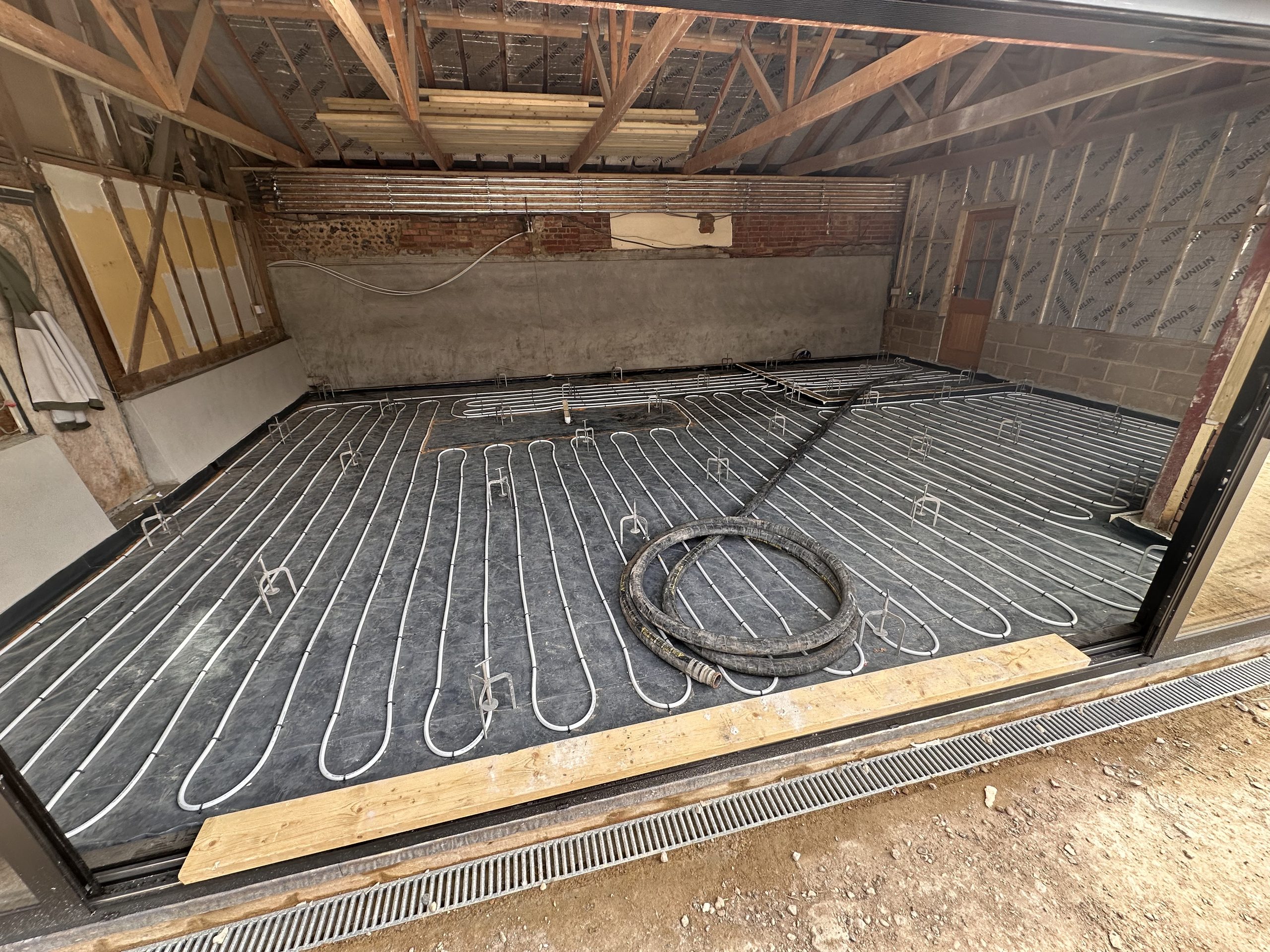 Underfloor heating pipework laid in an open-plan kitchen extension, Nedging Tye Underfloor heating pipework laid in an open-plan kitchen extension, Nedging Tye